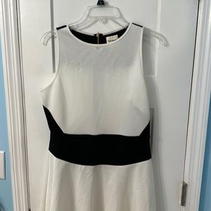 Ashley Graham off white with black waist band dress